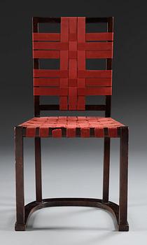 An Axel-Einar Hjorth black stained birch 'Futurum' chair with red girths by NK, Sweden,