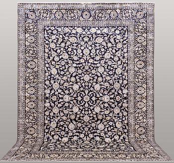 A carpet, Kashan, signed, ca 410 x 292 cm.