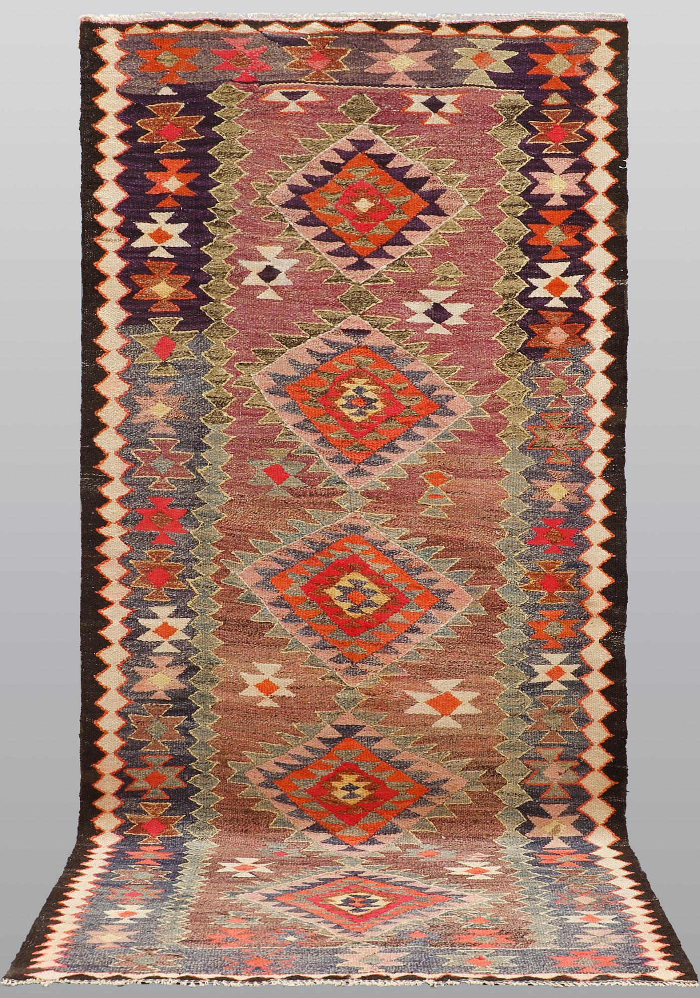 A Kelim rug, c. 253 x 120 cm.