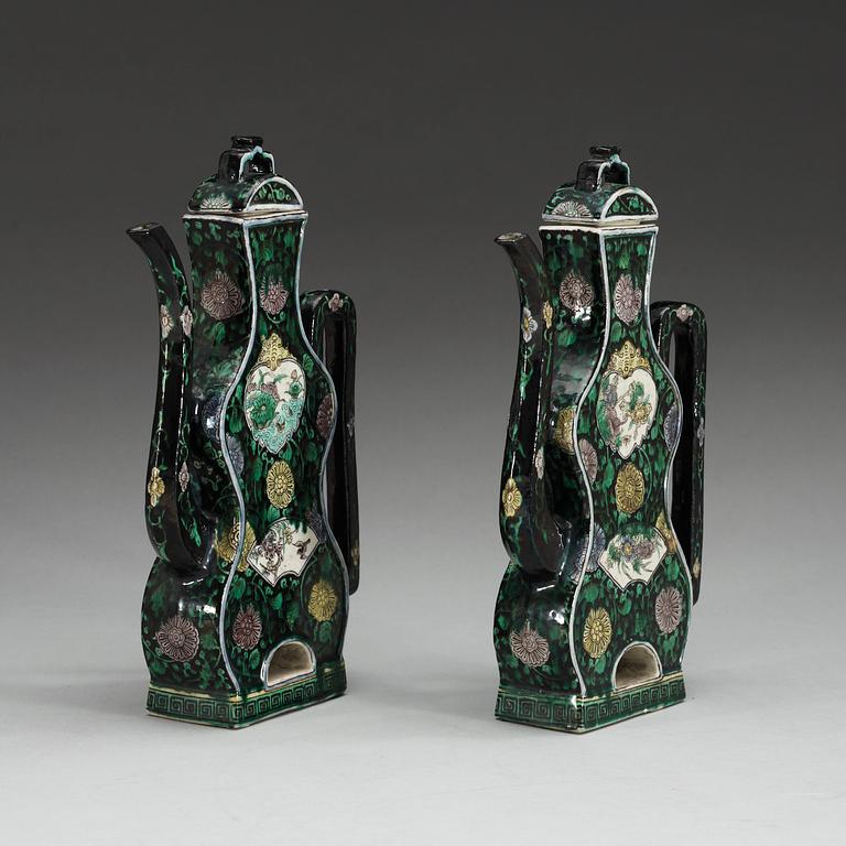 A pair of famille noire ewers with covers, Qing dynasty, 18th Century.