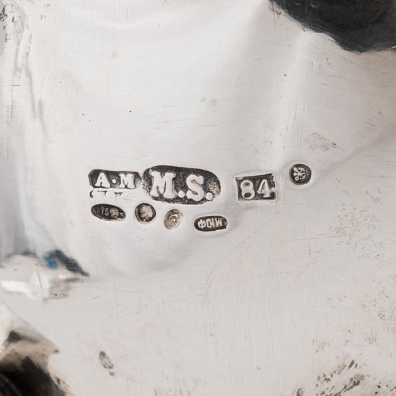 A Russian silver milk jug, and a silver fork, knife and spoon, Saint Petersburg 19th century.