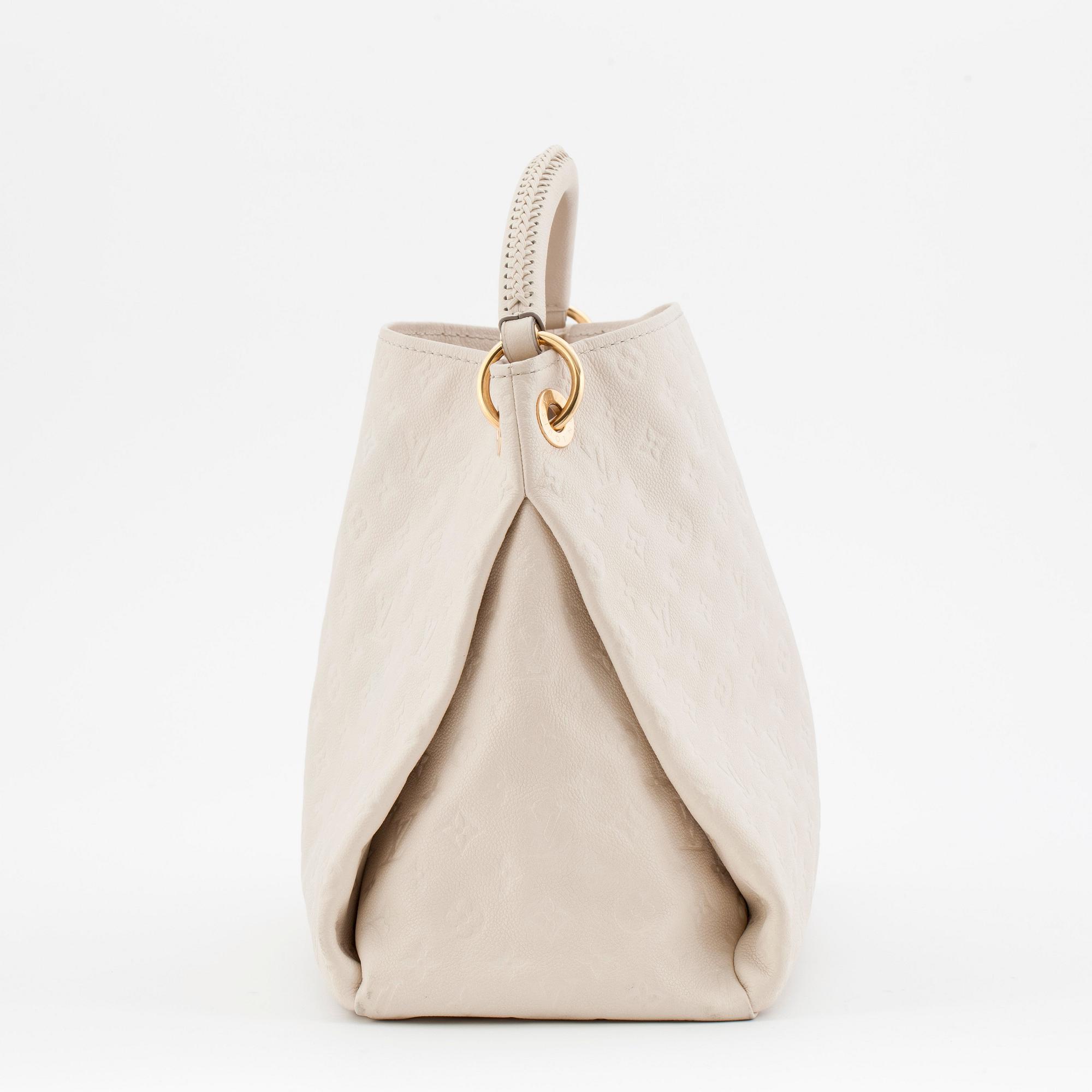 LOUIS VUITTON, a creme colored shoulder bag with embossed monogram print, "Artsy MM".