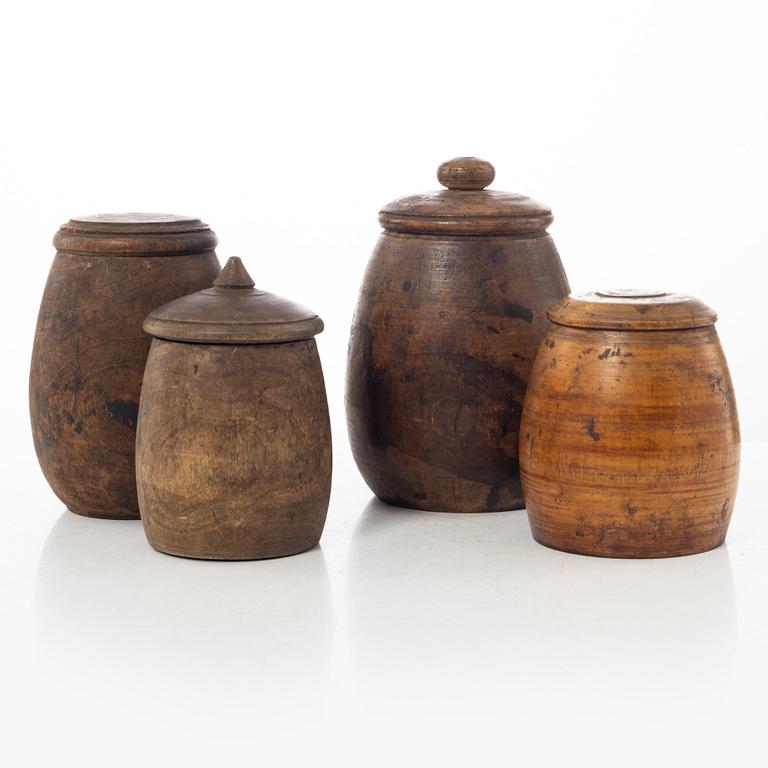 A set of four turned folk art jars, 19th century.