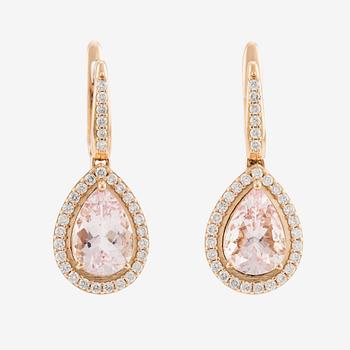 A pair of 18K gold earrings with faceted morganites and round brilliant-cut diamonds.