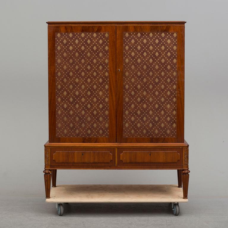 a mid 20th century mahogany cabinet.