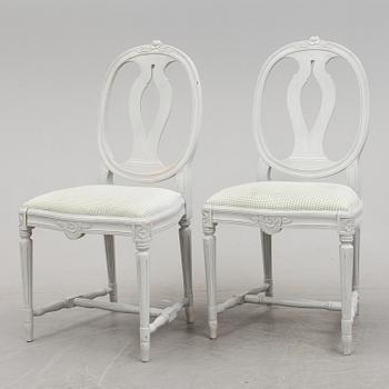 A Gustavian style dining table and ten chairs, 20th century.