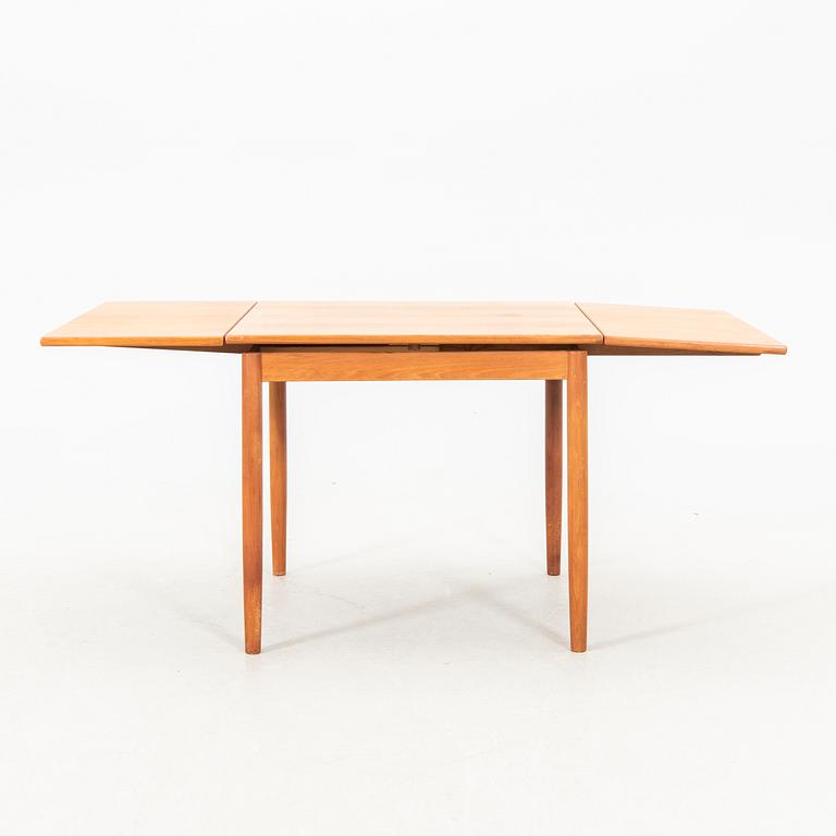 A teak table from the middle of the 20th century.