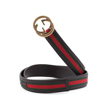 GUCCI, a striped belt.