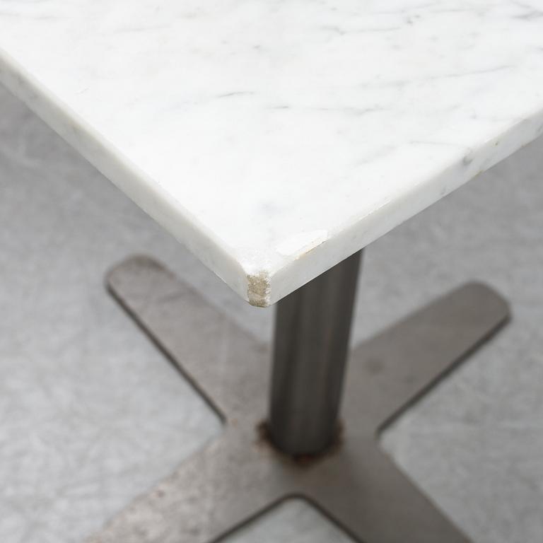 A marble top table, 21th century.