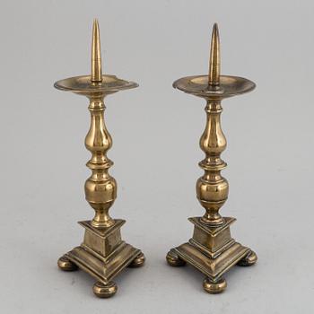 A pair of 17th century bronze candlesticks.