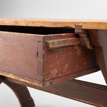 A Swedish folk-art trestle table from Dalarna, dated 1854.