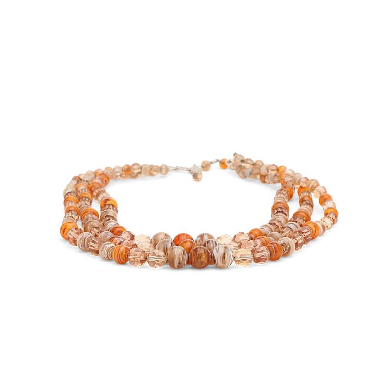 CHRISTIAN DIOR, an ambercoloured three strand glass beaded necklace, 1960s/70th.