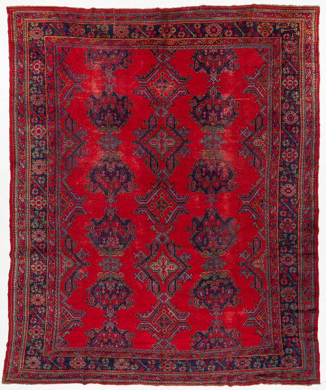 An antique Ushak carpet, Western Anatolia, approx. 380 x 313 cm.