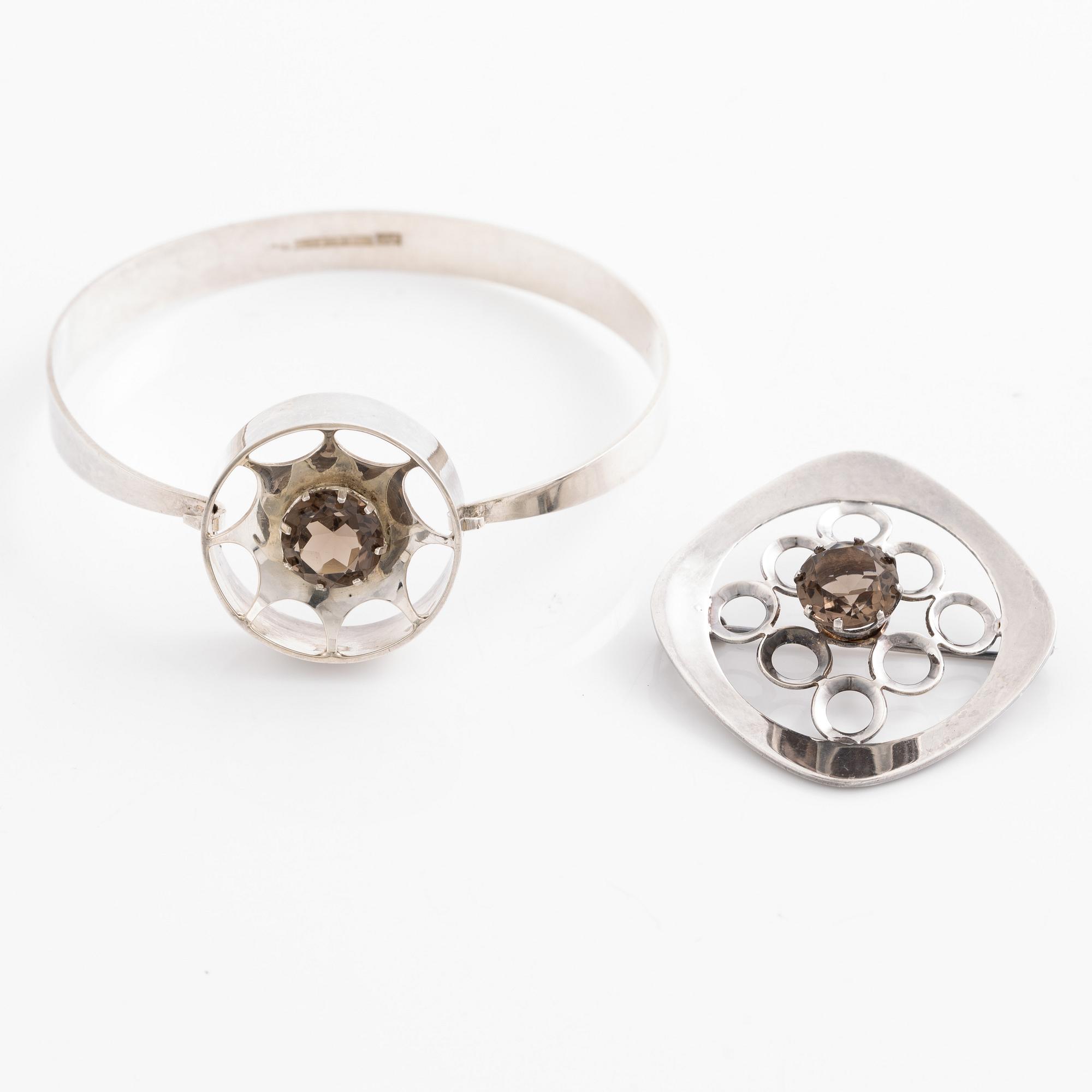 Arm ring and brooch, silver with smoky quartz, Kultasepät Salovaara.