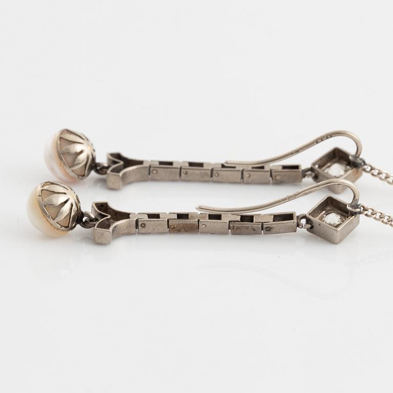 A pair of 18K gold and cultured halfpearl and diamond earrings.