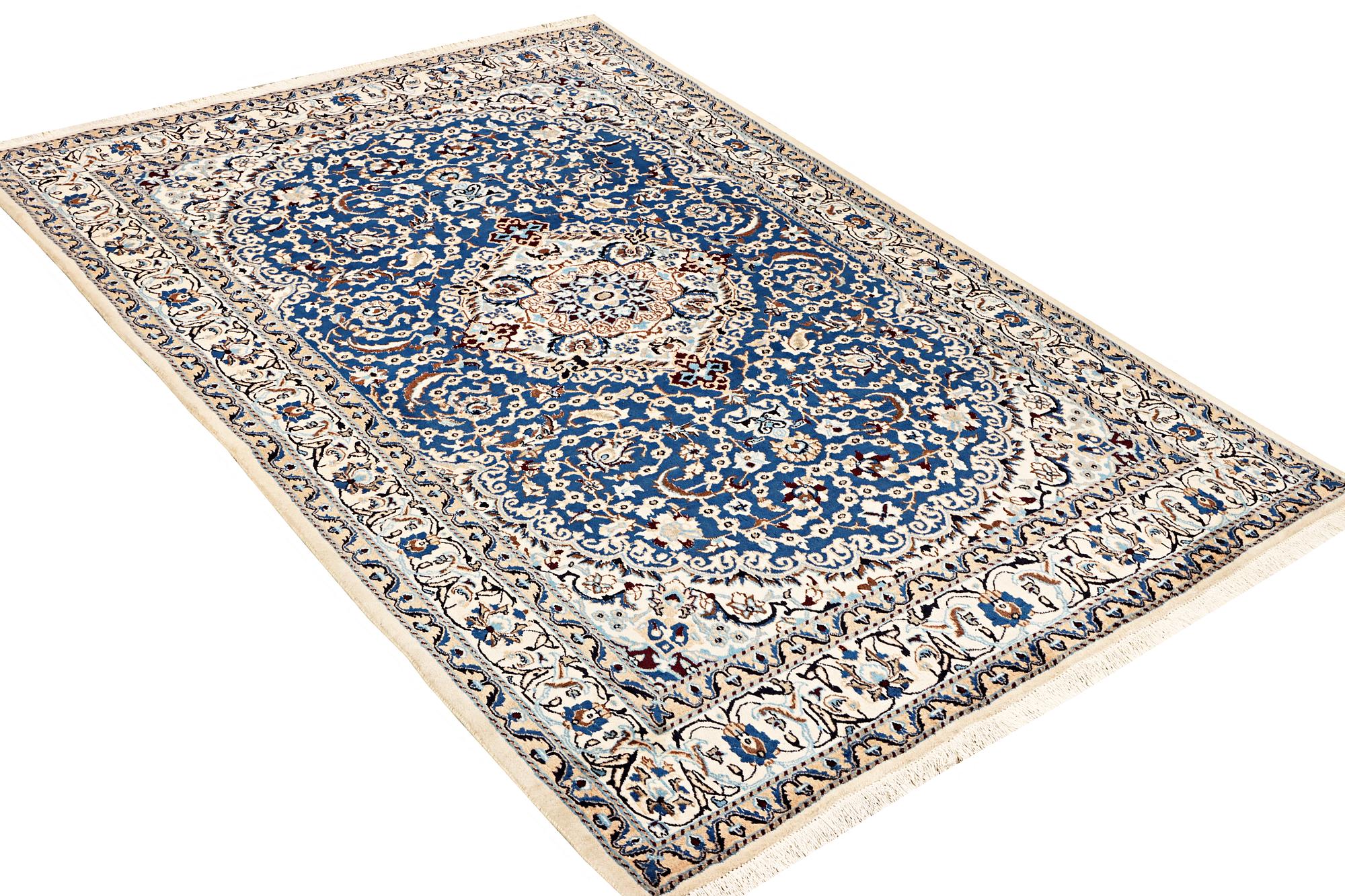 A Nain carpet, part silk, 9 laa, c. 300 x 189 cm.