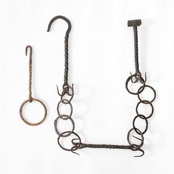 A set of two wrought-iron hangers, 18th century.