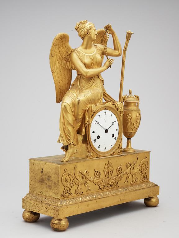 A French Empire early 19th century gilt bronze mantel clock.