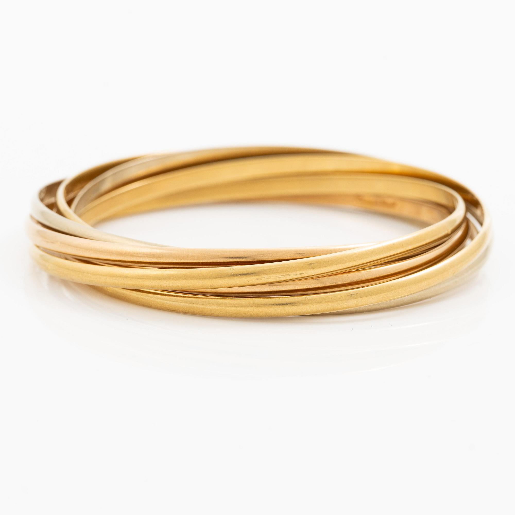 A Cartier bangle "Trinity" 18K gold in three colours.