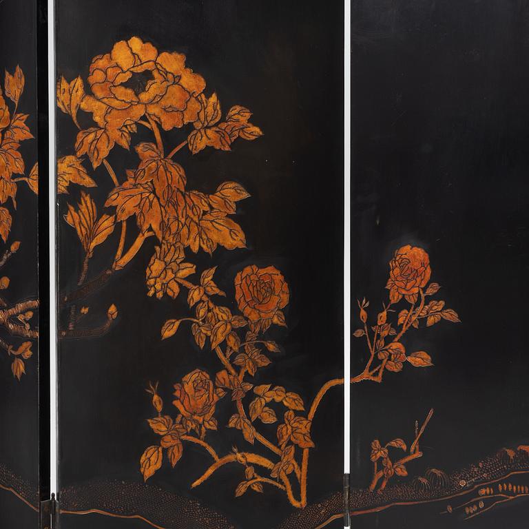 A Chinese lacquer folding screen, 20th century.