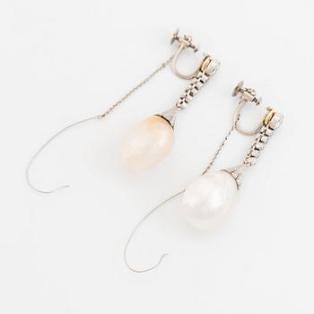 A pair of 18K gold and pearl earrings set with old- and rose-cut diamonds.