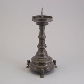 A 18th century pewter candlestick.