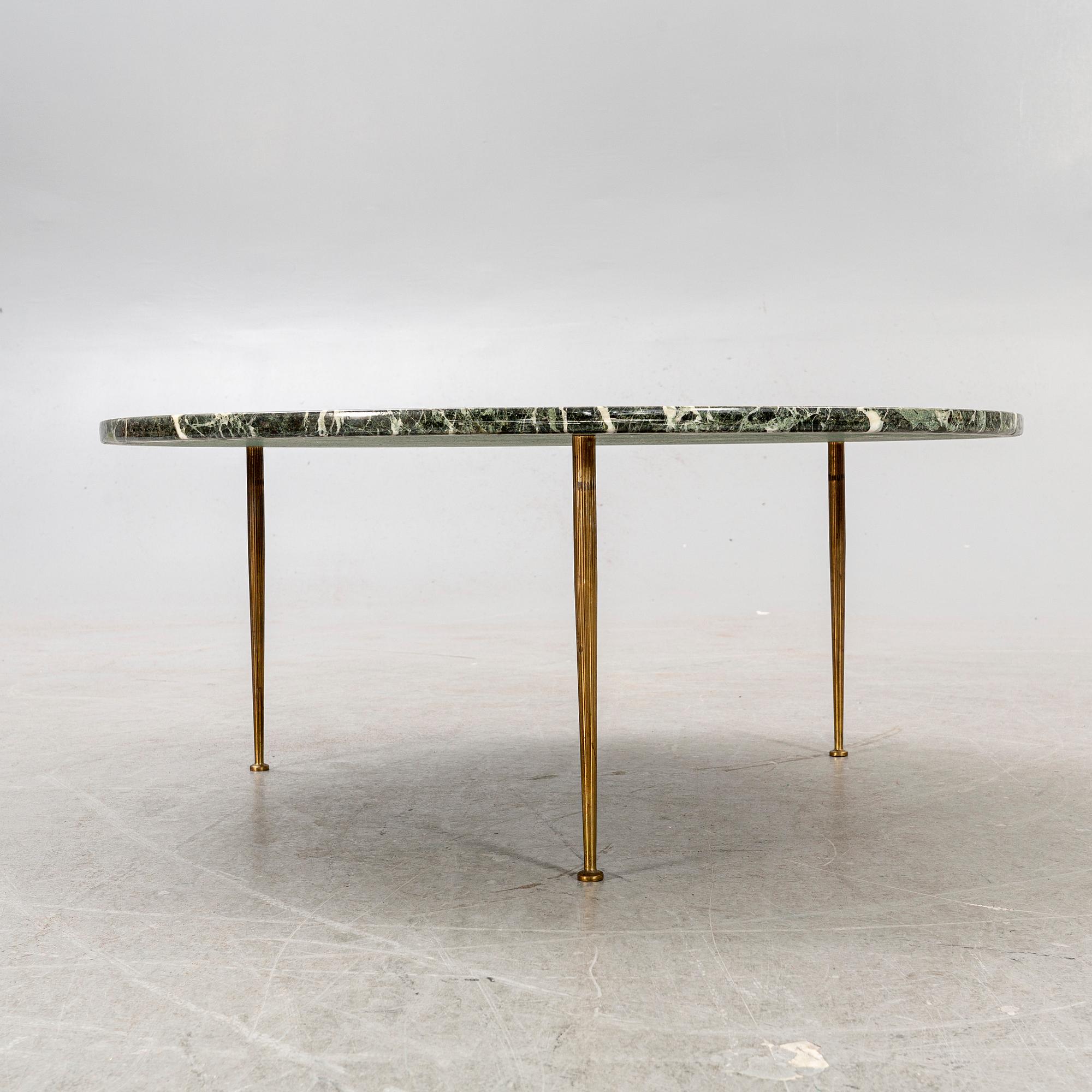 A marble coffee table alter part of the 20th century.