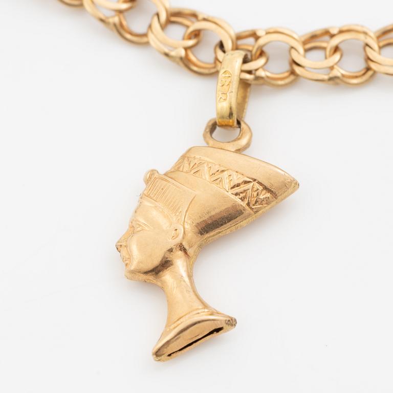 Bracelet, 18K gold bismarck link. With charms.