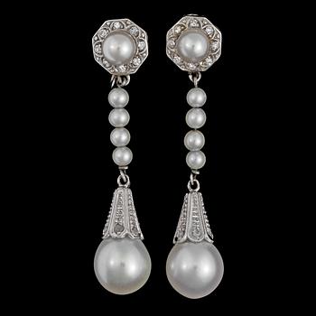 A pair of cultured pearl and diamond earrings, 1941.