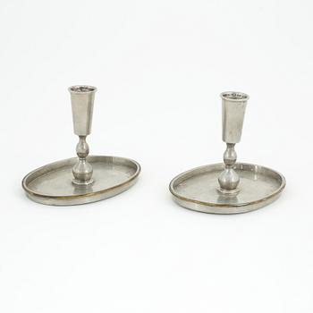 Nils Fougstedt, probably, a pair of pewter and brass candlesticks, model '93', for Firma Svenskt Tenn, Stockholm 1926.