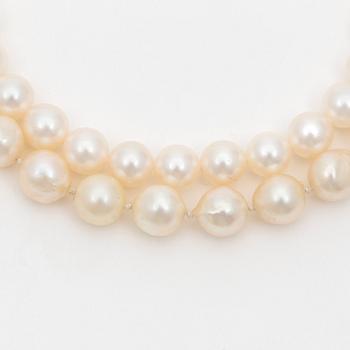 Two cultured pearl necklaces with silver clasps.