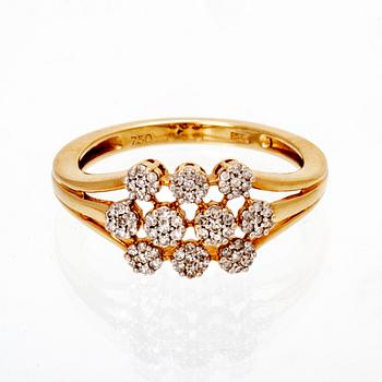 An 18K gold ring with octagonal cut diamonds.