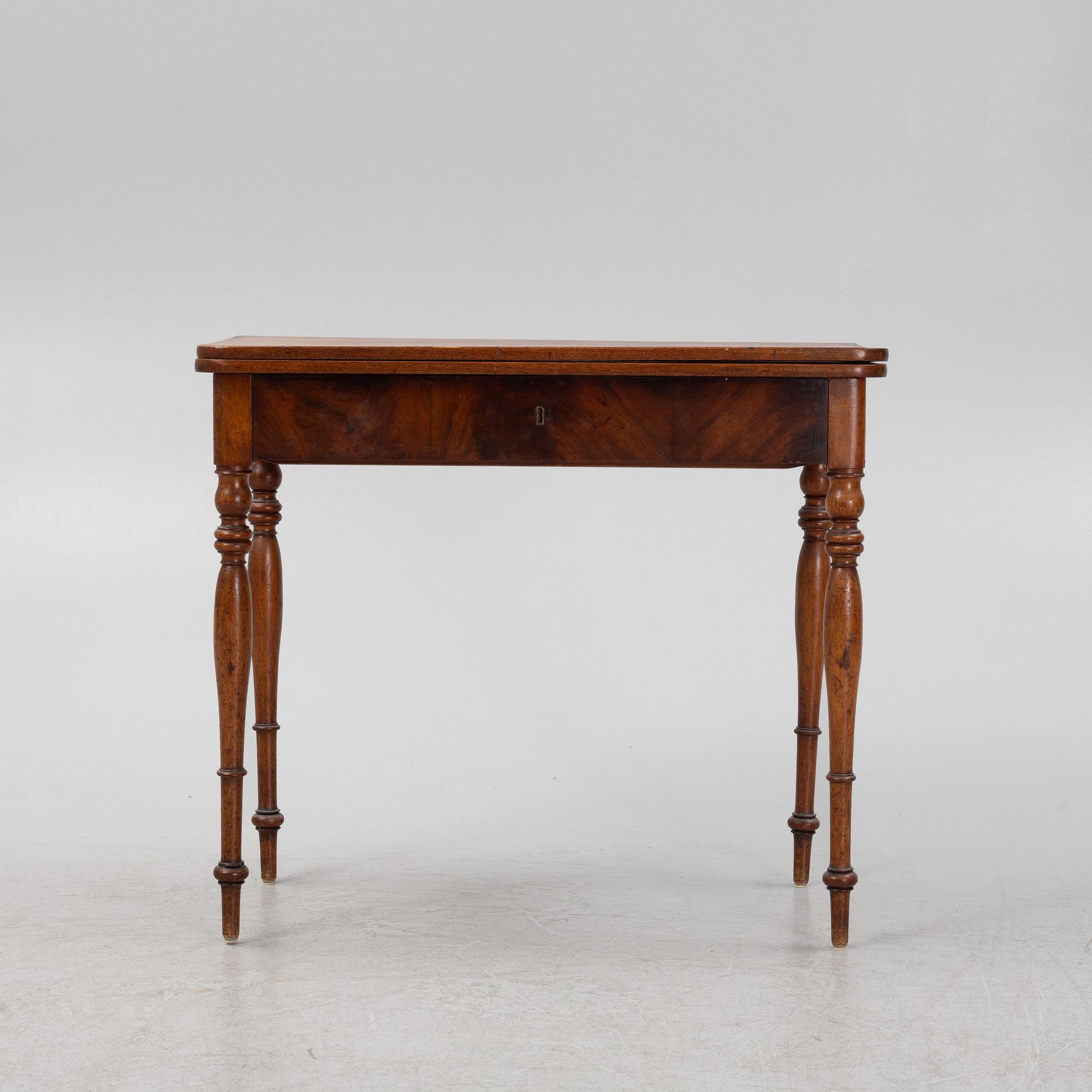 A mahogany games table, mid 19th Century.