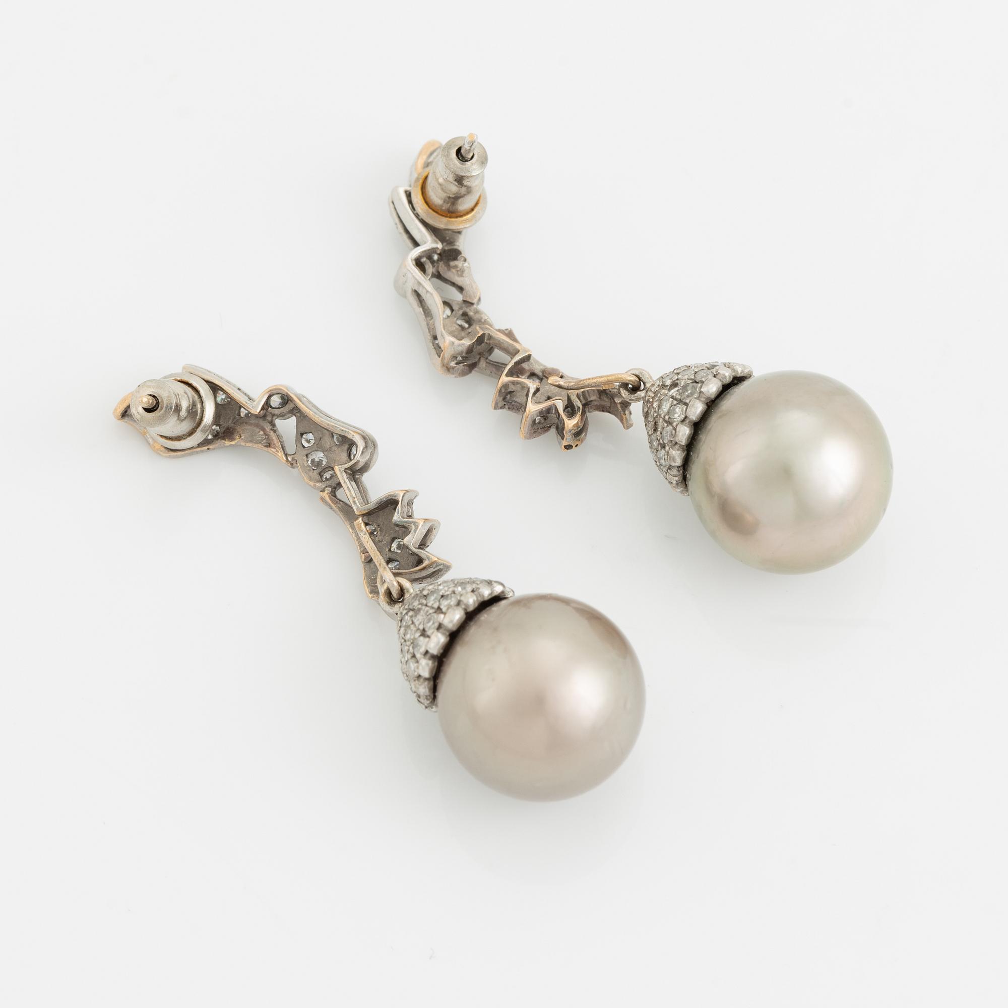 White gold, Tahiti pearl and brilliant cut diamond earrings.