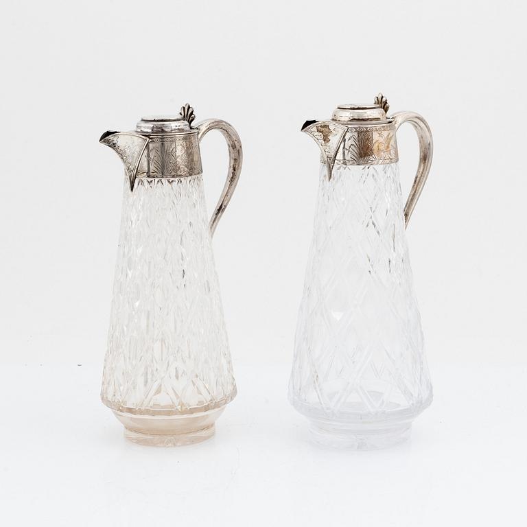 John Grinsell & Sons, a pair of silver and glass carafes, Birmingham 1880.