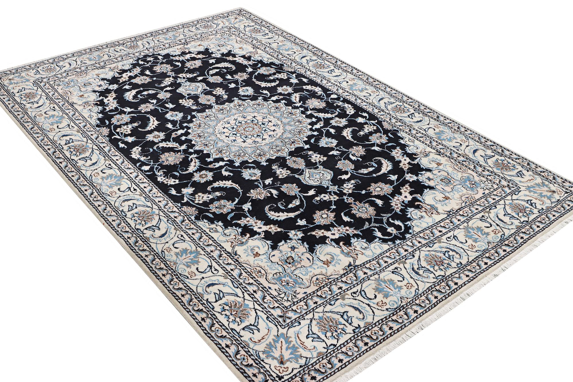 A Nain carpet, part silk, c. 286 x 206 cm.