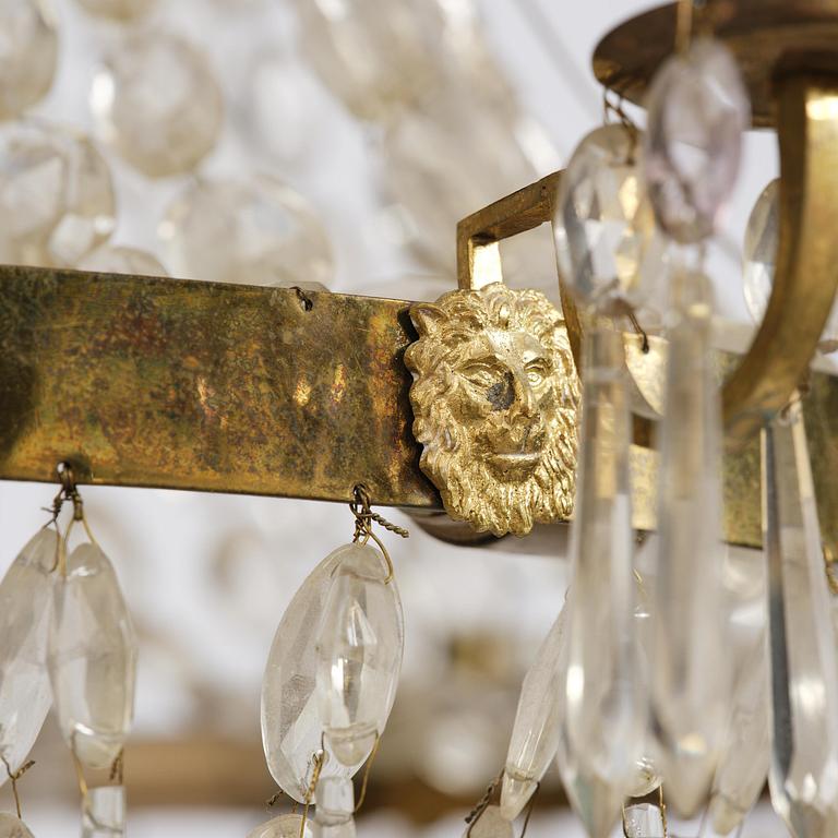 A Swedish gilt brass and cut glass thirteen-light Empire chandelier, early 19th century.