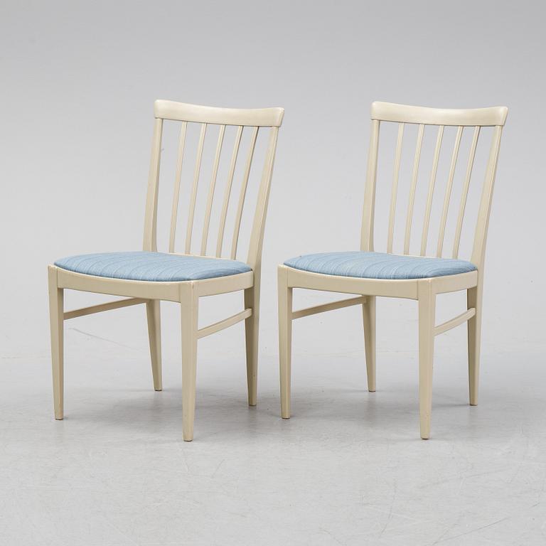 A dining table with six chairs by Carl Malmsten, second half of the 20th Century.