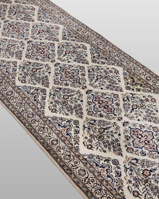 A Nain part silk carpet, 408 x 98 cm.