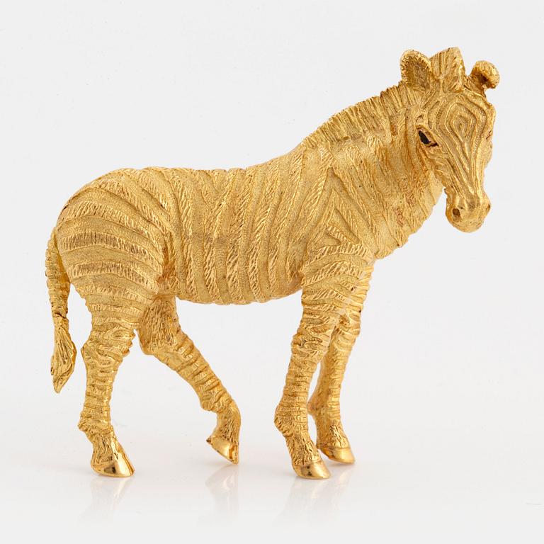A Tiffany brooch in 18K gold set with sapphires designed as a zebra.