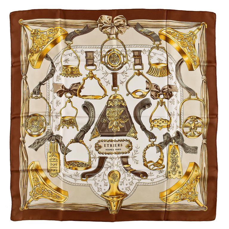 A set of three silk scarves by Hermès, "Etriers" and "Thalassa".