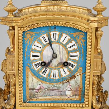 A late 19th Century bronze and porelain mantel clock.