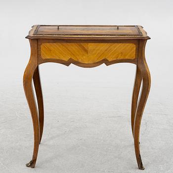 A Louis XV style table, circa 1900.