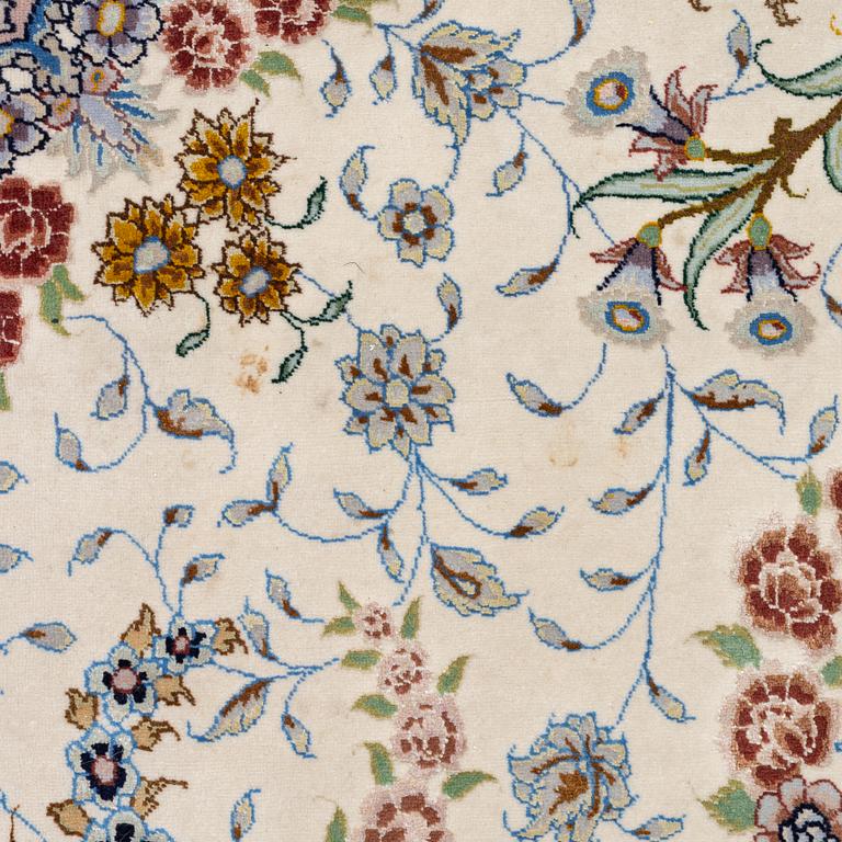 A Tabriz carpet north west Persia, part silk, c. 314 x 197 cm.