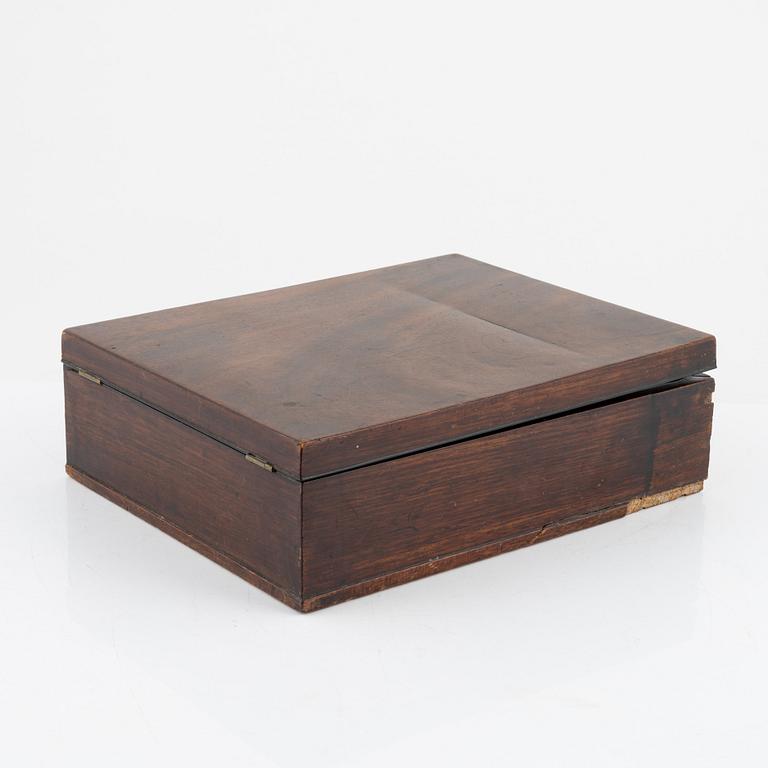 An early 19th century mahogny-veneered box for shaving utensils.