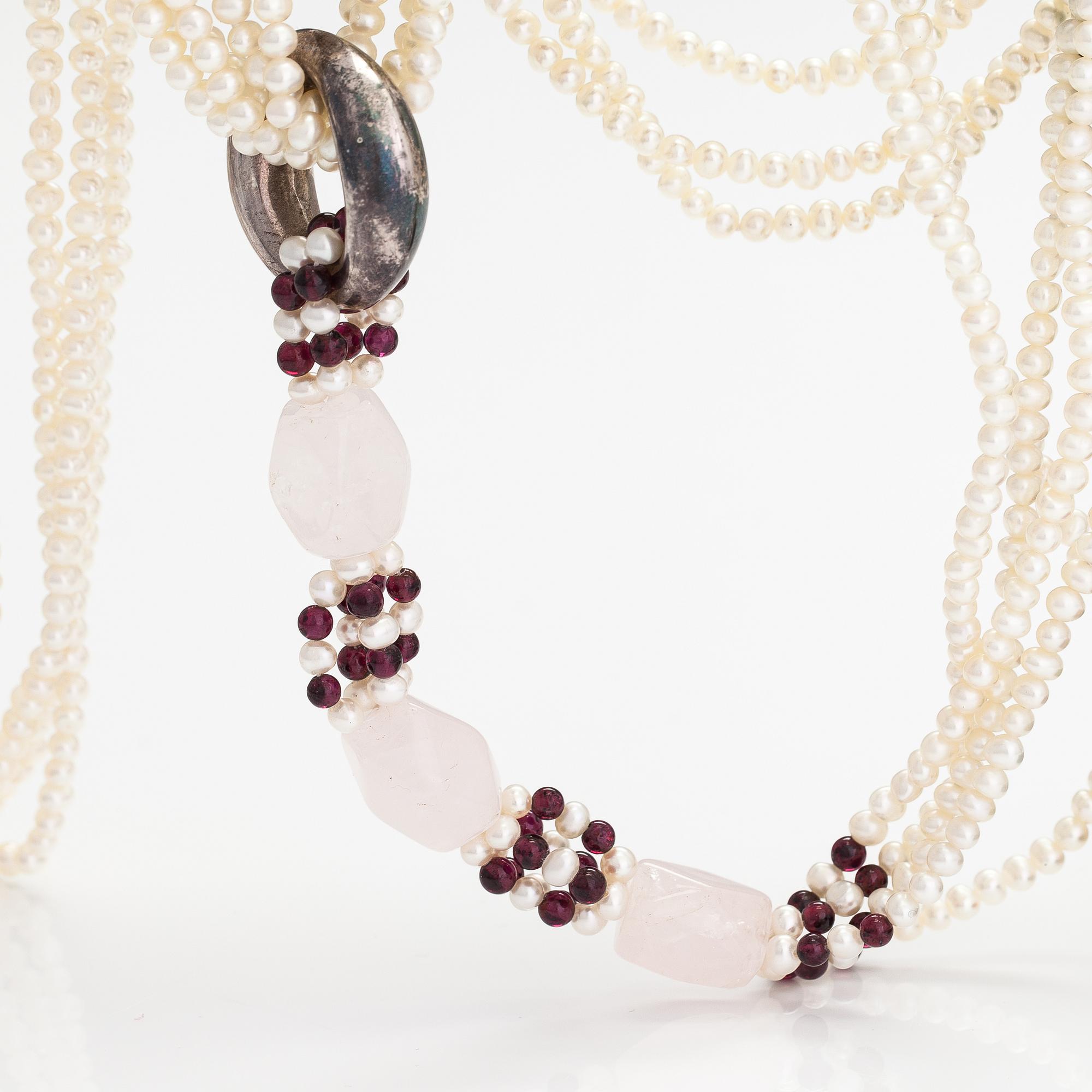 A sweet water, rose quartz, garnet and wood pearls collier with a Tiffany & co silver ring designed by Elsa Peretti.