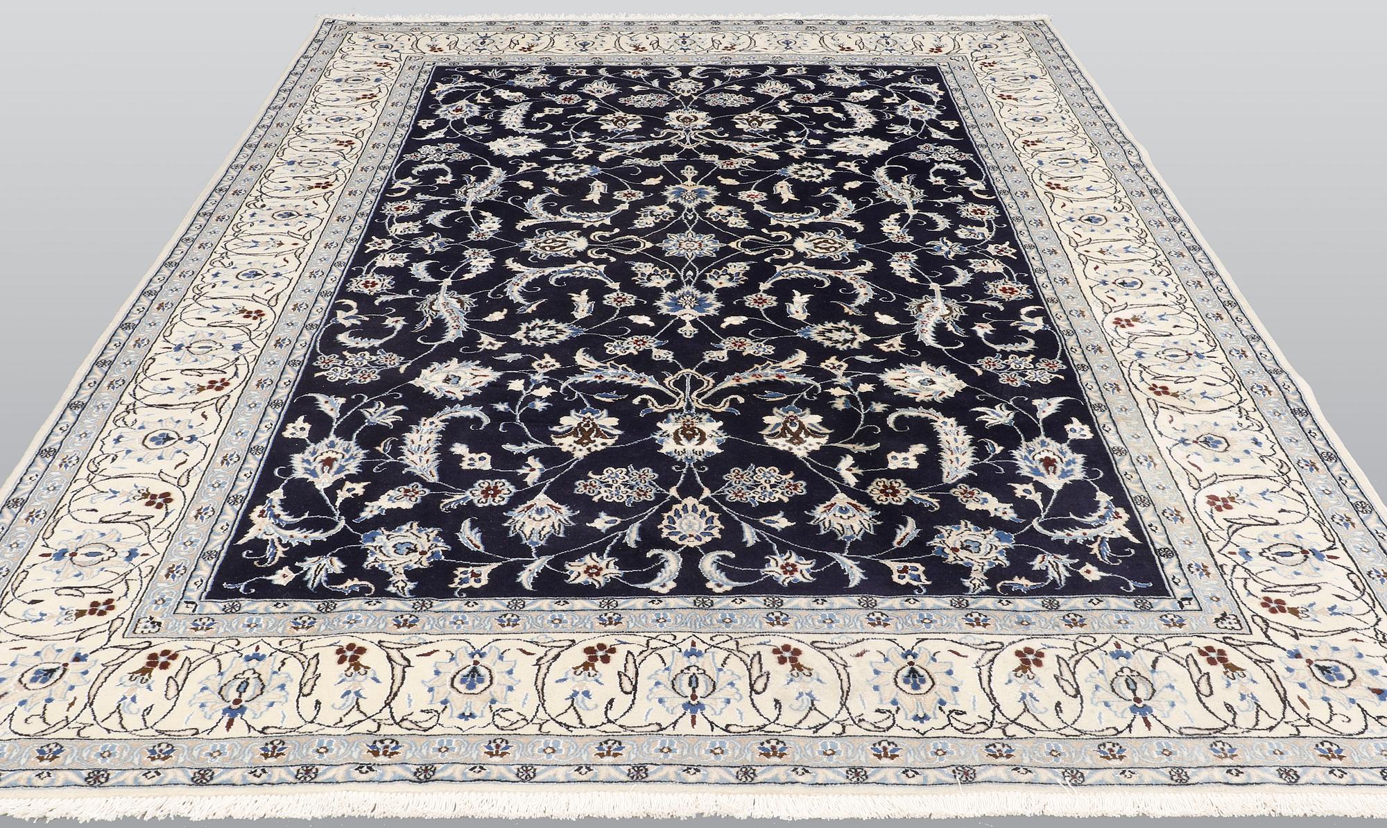 A carpet, Nain, part silk, ca 350 x 247 cm.