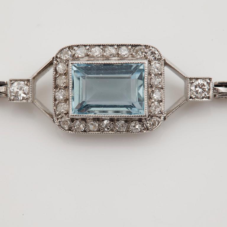 A step-cut aquamarine, old and single cut diamond bracelet.