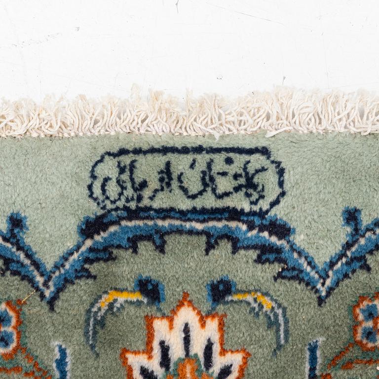 A Keshan carpet, signed, c. 376 x 270 cm.
