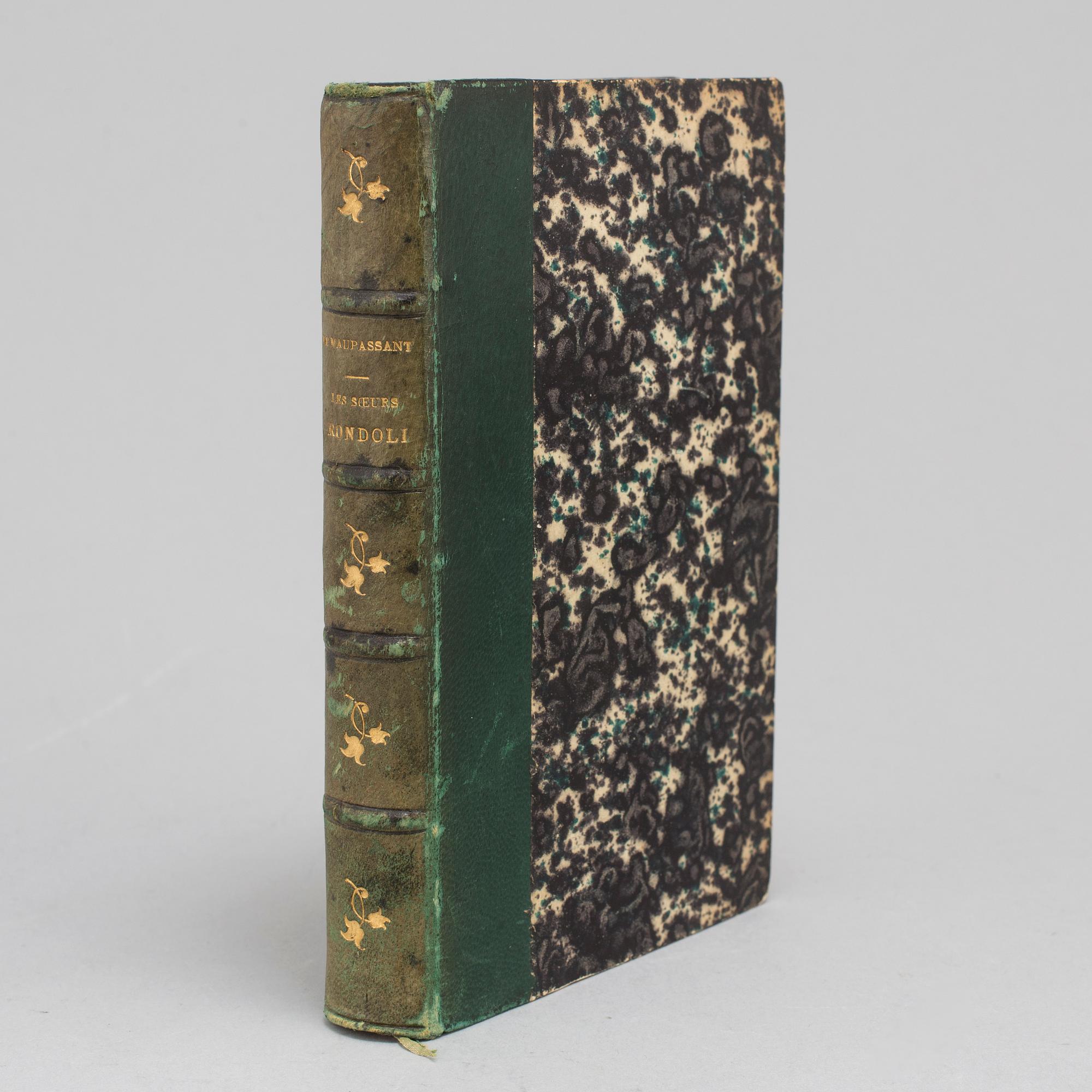 BOOK, inscribed by Maupassant.